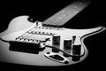 Black and white electric guitar on a black background Royalty Free Stock Photo